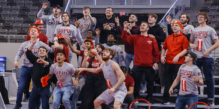 Students in the crowd at an IUPUI sporting event.